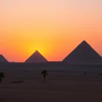 Discover the breathtaking Giza Pyramids sunset imagery related to https://emegypt.net's historical significance.