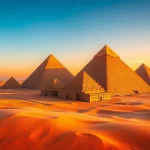 A breathtaking aerial view of the piraminds surrounded by golden sands at sunset.