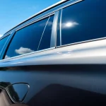 Enhance visibility with premium window tint Chattanooga on sleek vehicle parked in city.